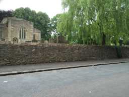 Oblique view of wall around right side of Yard to Church of St. Helen July 2016